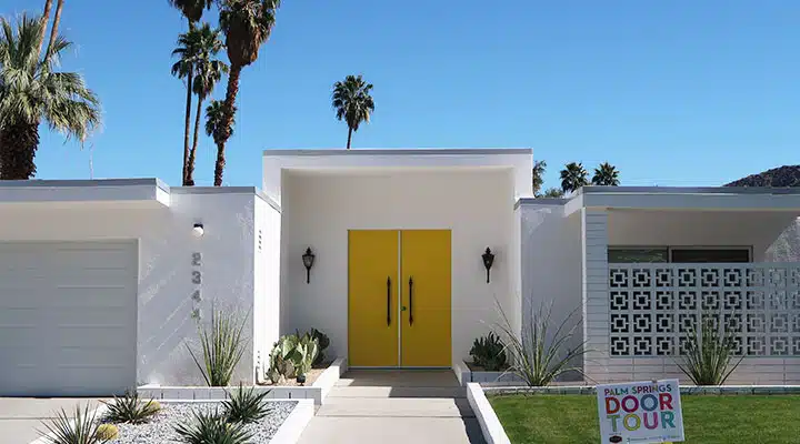 A palm tree in front of a building