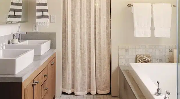 A shower that has a sink and a mirror
