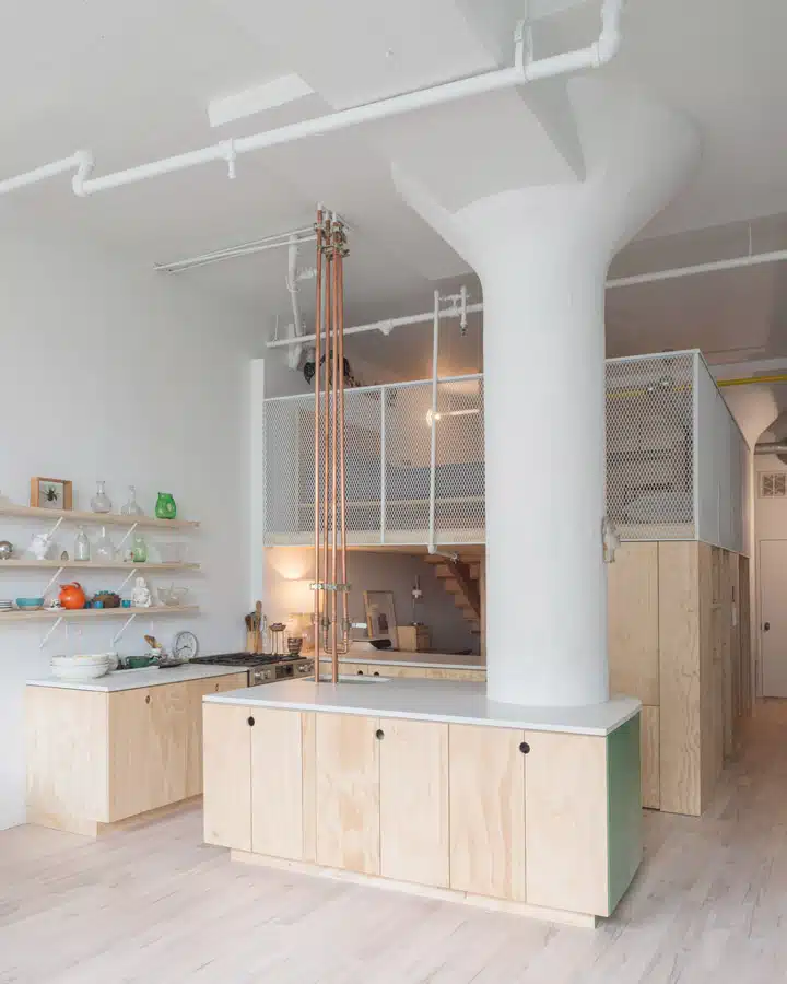 A kitchen with a building in the background