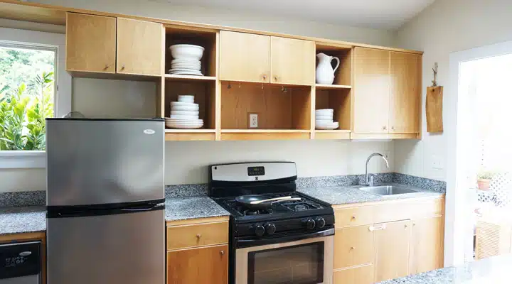 A stove top oven sitting inside of a kitchen