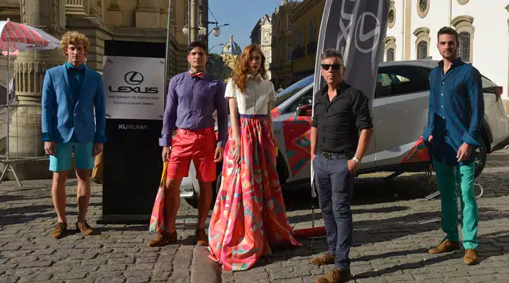 A group of people walking down the street