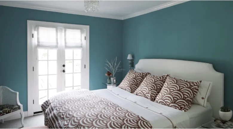 A bedroom with a bed in a room