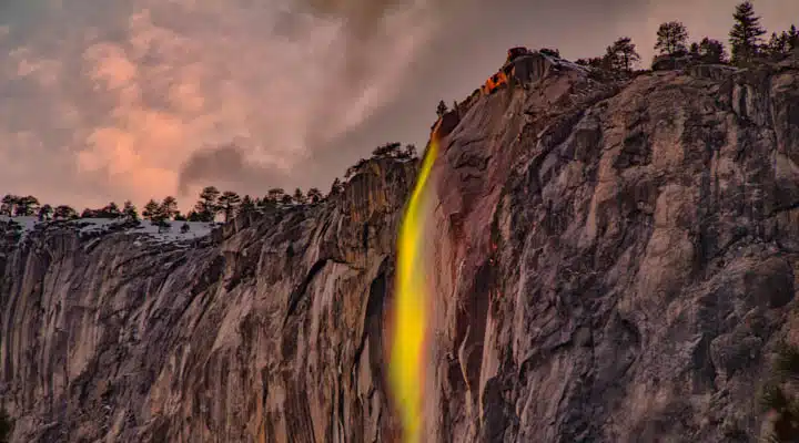 A canyon with a mountain in the background