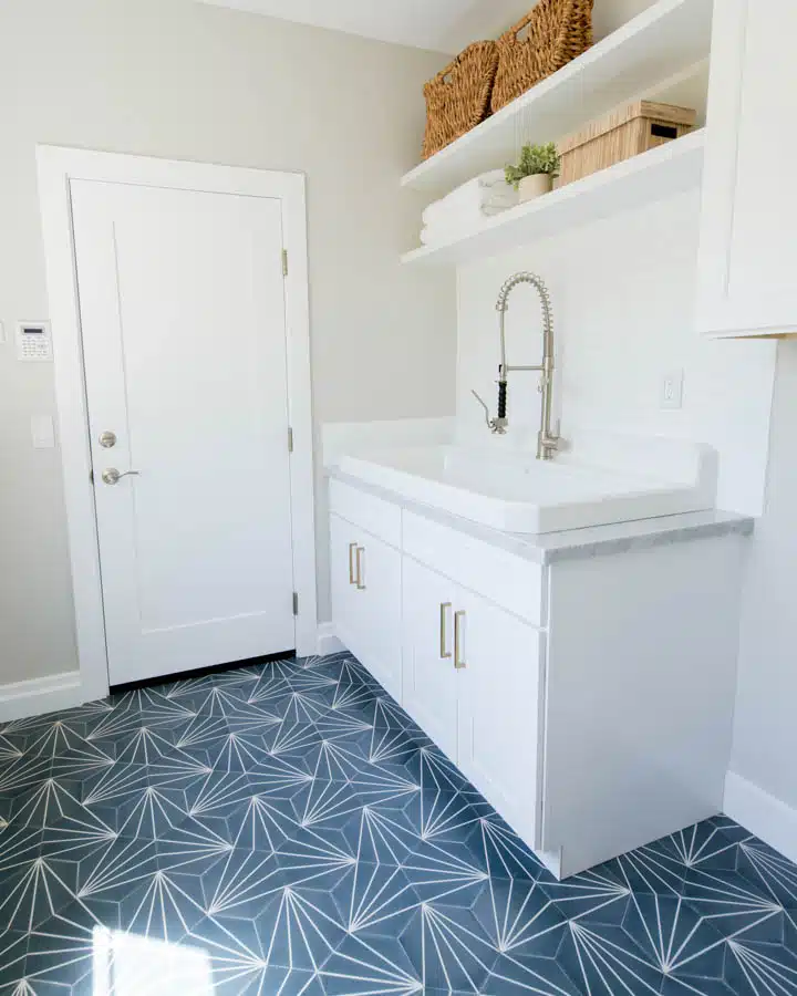 A kitchen with a sink and a mirror