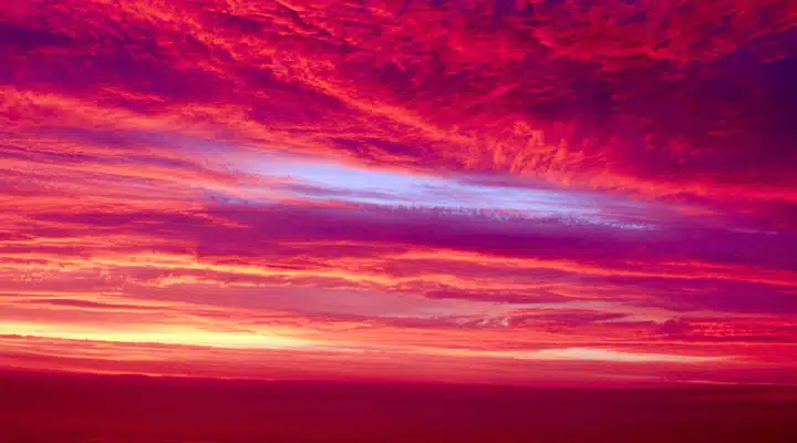 A sunset over a body of water