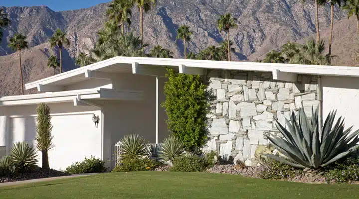 A house with a mountain in the background