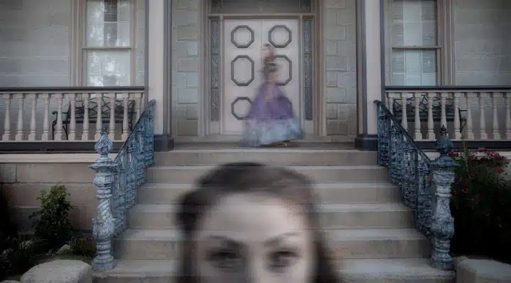 A person standing in front of a building