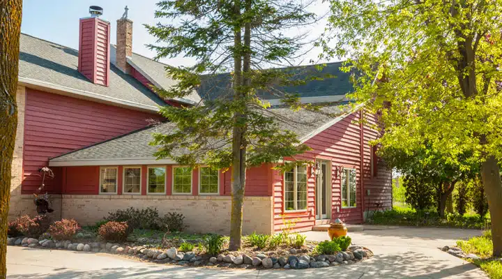 A tree in front of a house