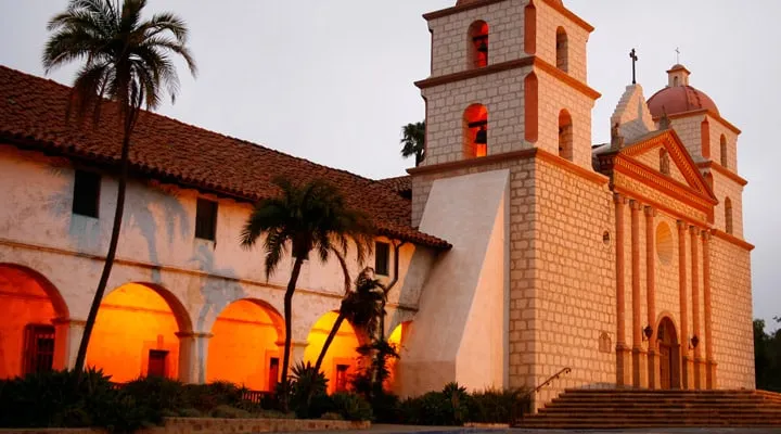 A church with a clock on the side of a building