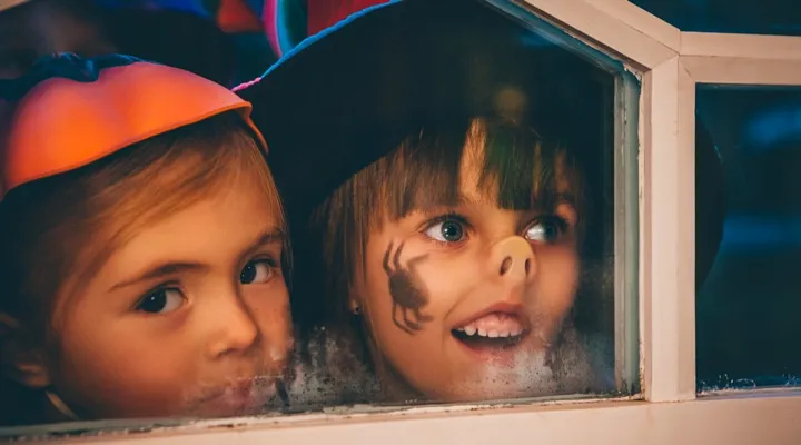 A close up of a boy and a girl looking at the camera