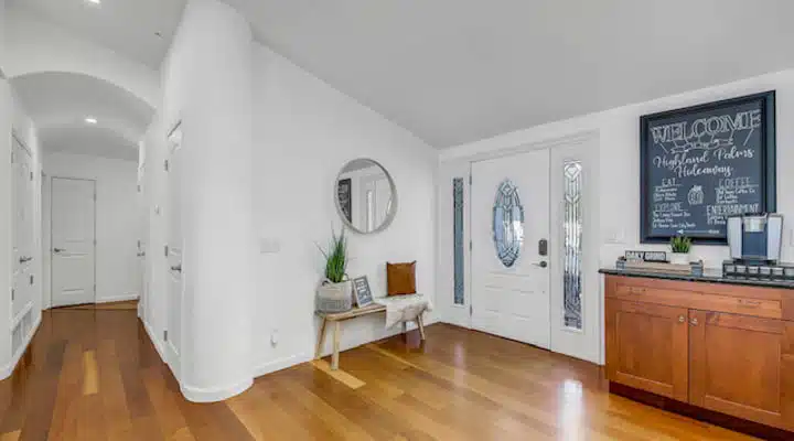 A living room with a hard wood floor