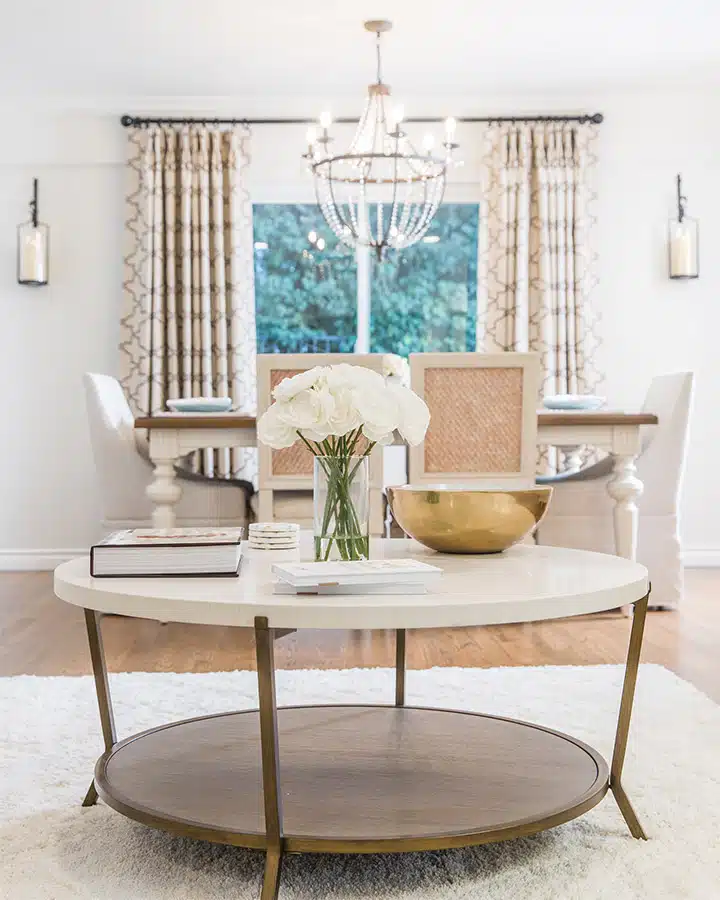 A room filled with furniture and vase on a table