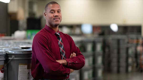 A man standing in front of a building