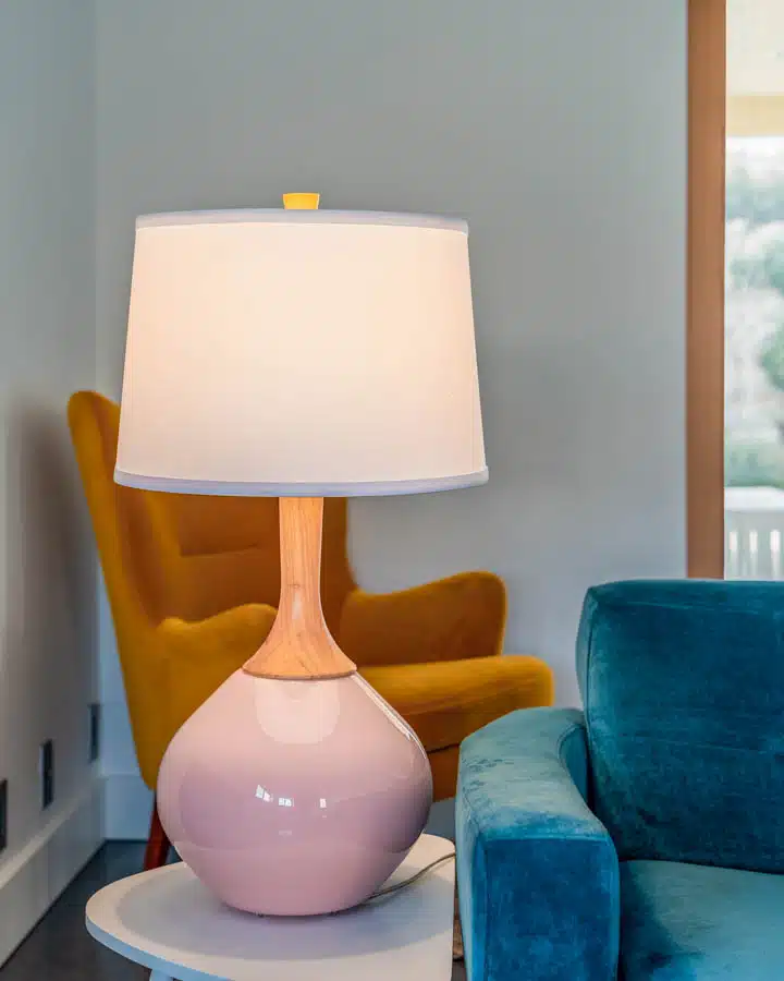 A living room filled with furniture and vase on a table