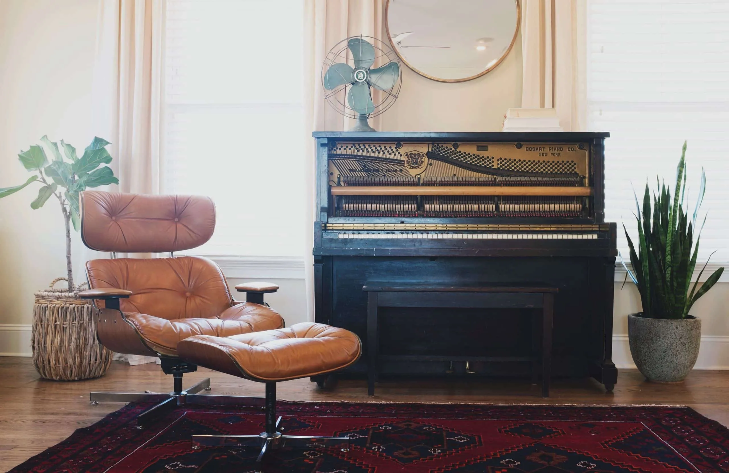 A fire place sitting in a living room filled with furniture and a fireplace