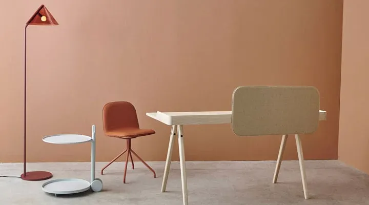 A chair sitting in front of a wooden table