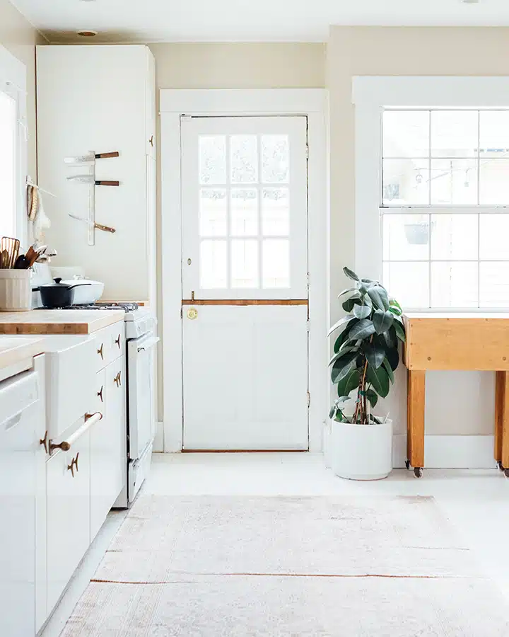 A kitchen with a sink and a window