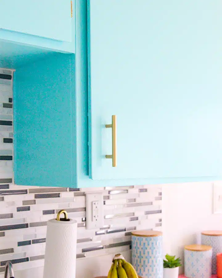 A kitchen with a sink and a window