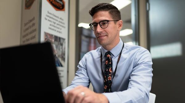 A man wearing a suit and tie