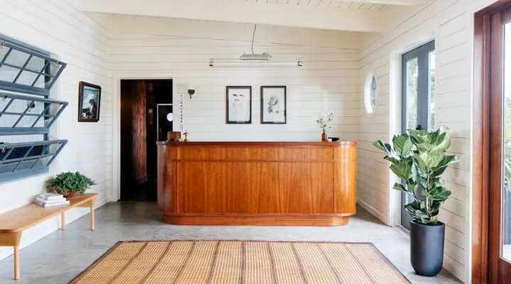 A living room filled with furniture and a large window