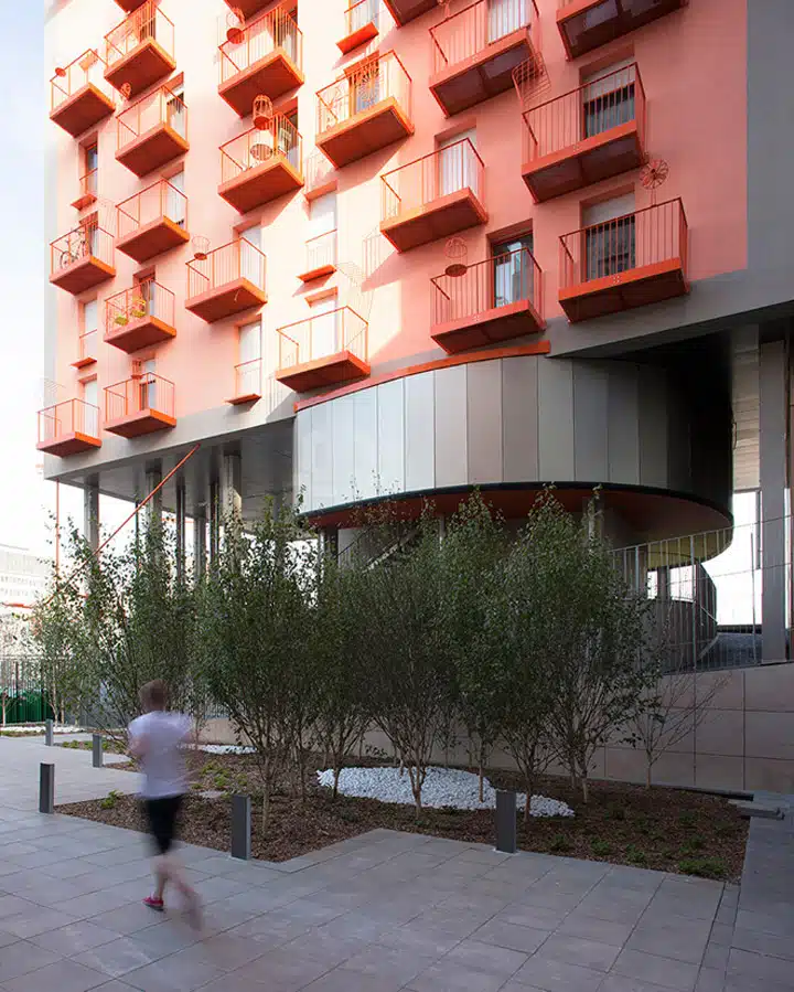 A person standing in front of a building