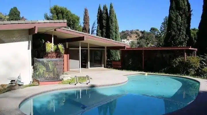 A pool outside of a building