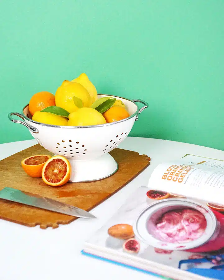 A bowl of fruit sitting on a table