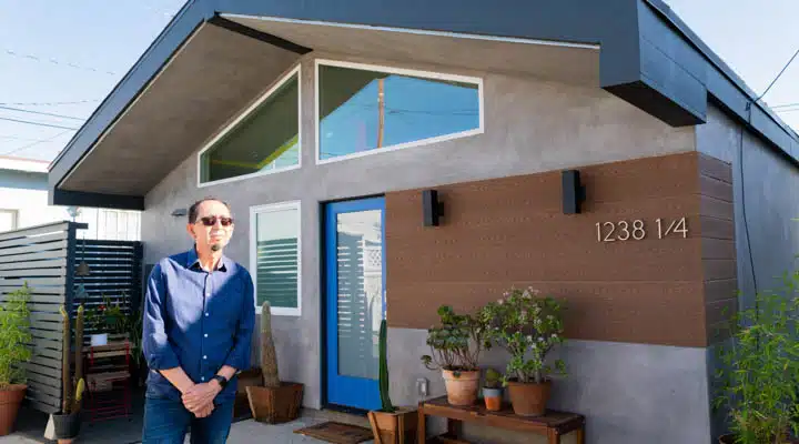 A person standing in front of a building