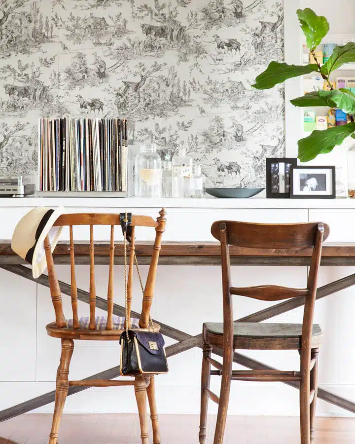 A dining room table in front of a wooden chair