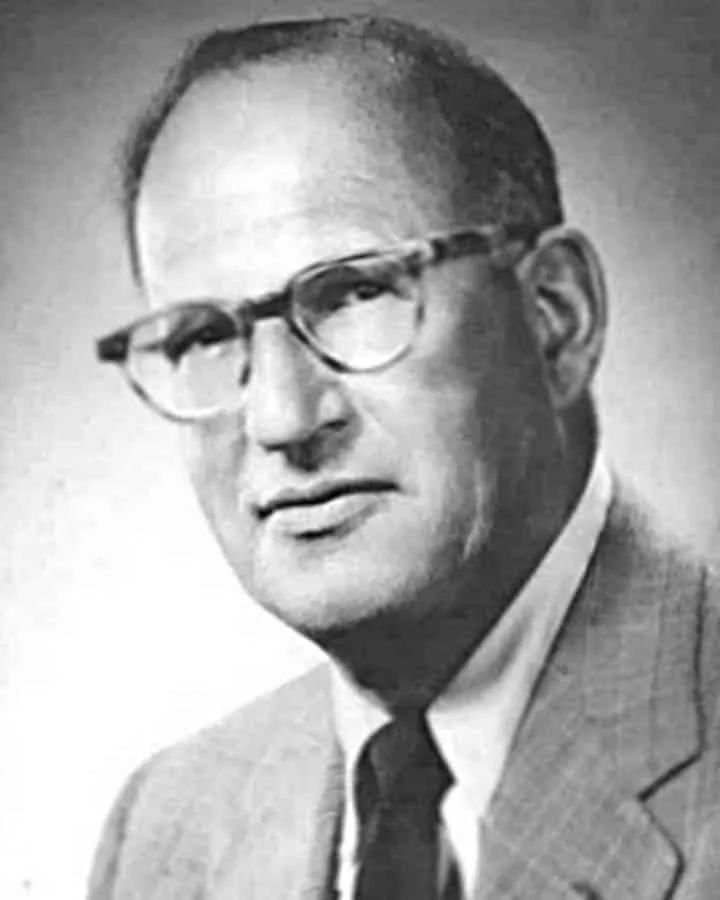 A man wearing glasses posing for the camera