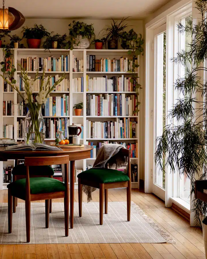 A living room filled with furniture and a book shelf