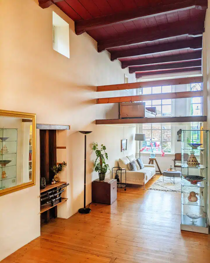 A living room filled with furniture and a large window