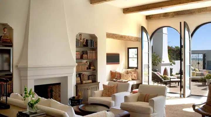 A living room filled with furniture and a fire place