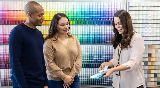 A group of people standing next to a woman