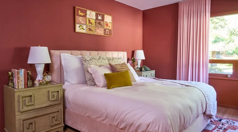 A bedroom with a large bed in a hotel room