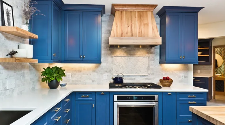 A kitchen with a stove top oven sitting under a blue sky