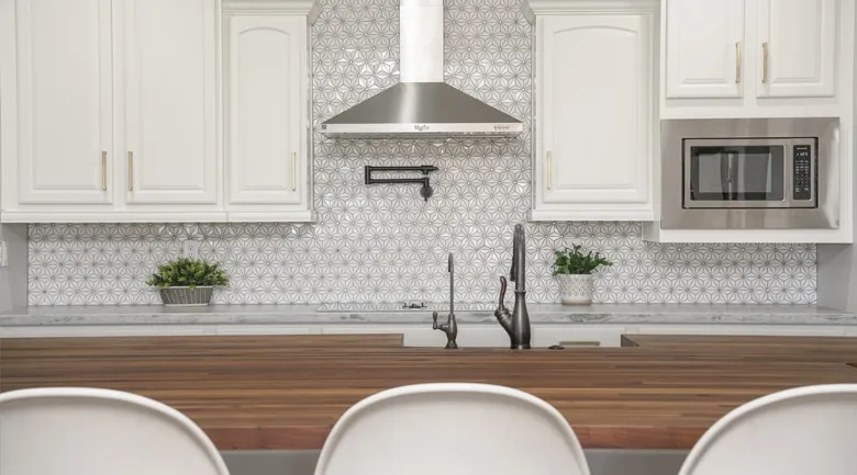 A kitchen with a sink and a window