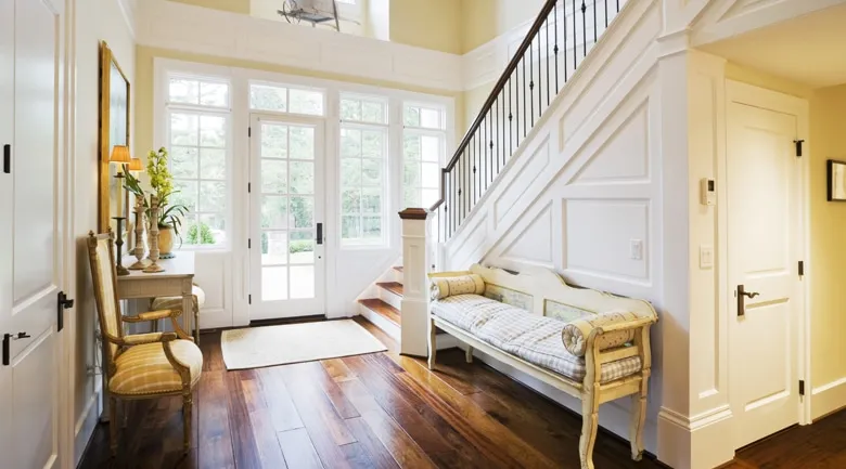 A living room filled with furniture and a large window