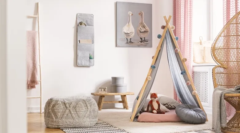 A bedroom with a bed and a chair in a room