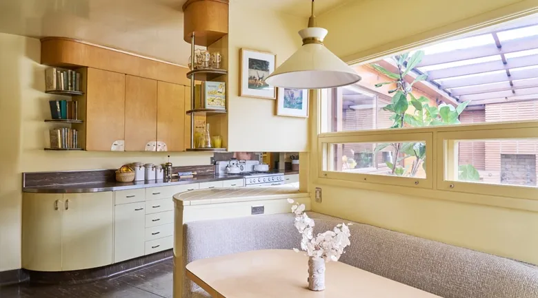 A kitchen with a sink and a window