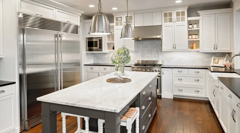 A modern kitchen with stainless steel appliances and wooden cabinets