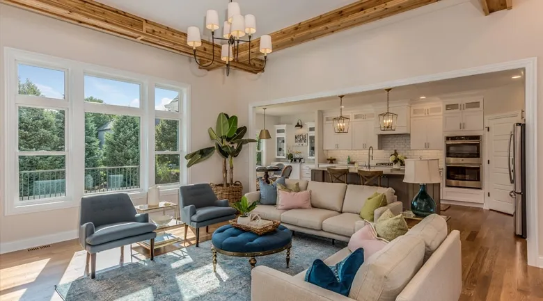 A living room filled with furniture and a large window