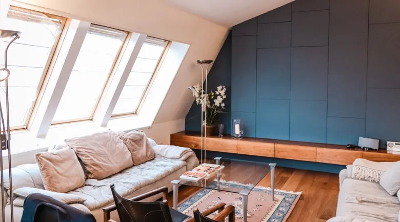 A living room filled with furniture and a large window