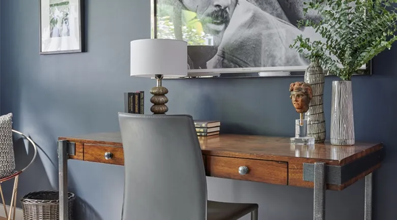 A room filled with furniture and vase on a table