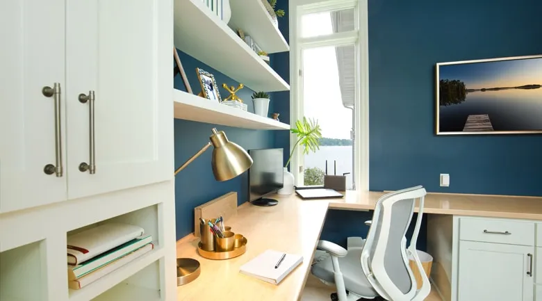 A kitchen with a table in a room