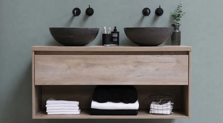 A vase sitting on top of a wooden counter