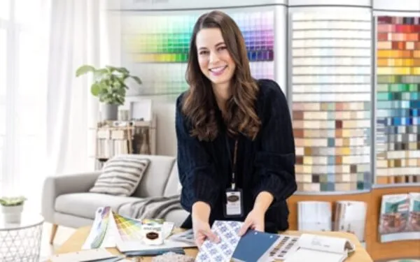 A person sitting at a desk in front of a window