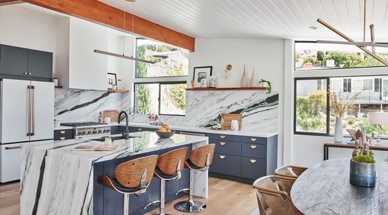 A kitchen with an island in the middle of a room