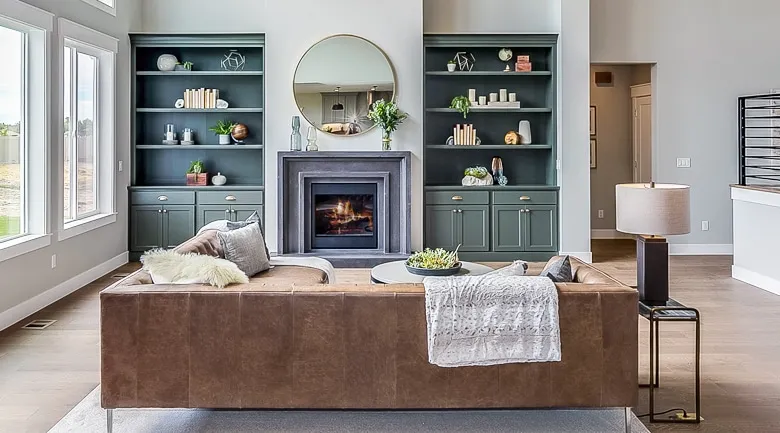 A living room filled with furniture and a large window