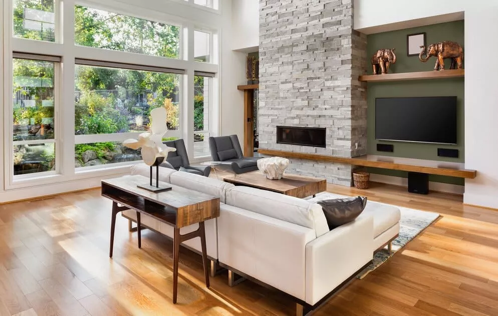 A living room filled with furniture and a fireplace